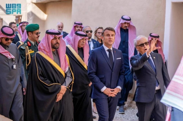 French President Emmanuel Macron tours the historic Turaif District in Diriyah on Tuesday.