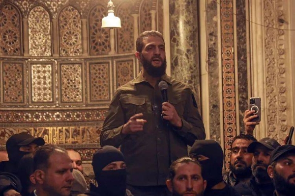 Abu Mohammed al-Golani, leads the biggest rebel faction and is poised to chart the country's future, speaks at the Umayyad Mosque in Damascus Sunday Dec. 8, 2024