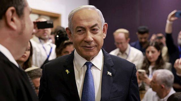 Israeli Prime Minister Benjamin Netanyahu arrives at the district court in Tel Aviv on Tuesday