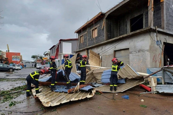 This photo provided December 15, 2024 by the Civil Security shows rescue workers clearing an area in the French territory of Mayotte, after Cyclone Chido caused extensive damage