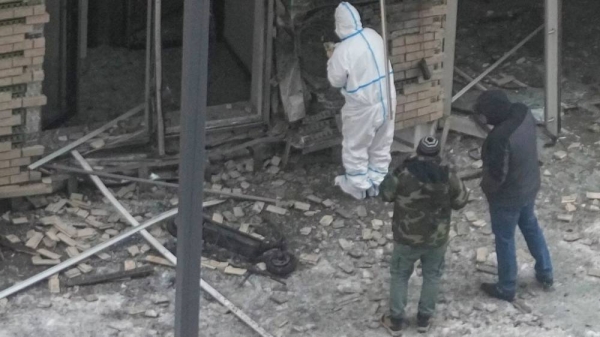 Investigators work near a scooter at the place where Kirillov and his assistant were killed by an explosive device on 17 December, 2024