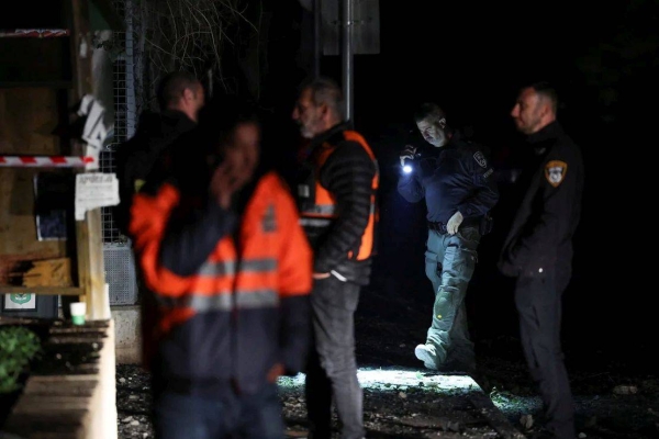 Israeli police bomb squad members work near a damaged site after a projectile fired from Yemen was intercepted, in Ramat Gan, Israel on December 19, 2024