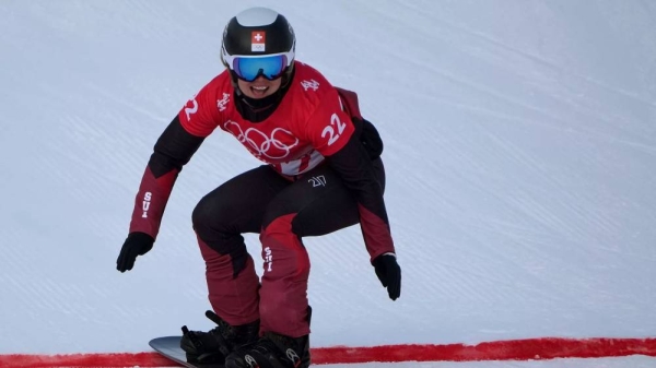 Sophie Hediger competes during the women's snowboard cross qualification round at the 2022 Winter Olympics, Feb. 9, 2022, in Zhangjiakou, China