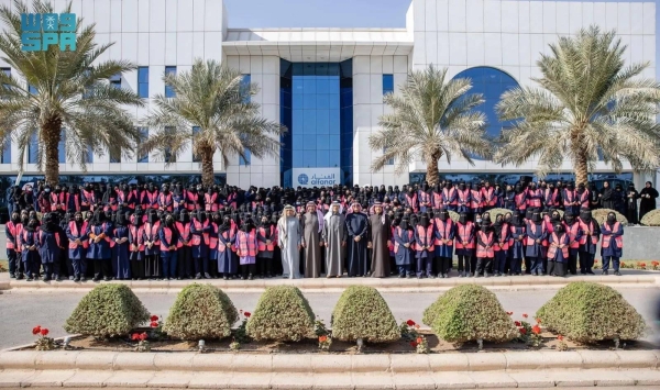 Minister of Energy Prince Abdulaziz bin Salman and other ministers pose for a photo with the Saudi female employees during their visit to Alfanar factories in Riyadh on Wednesday.