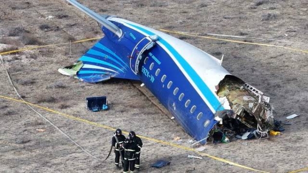 A drone view shows emergency specialists working at the crash site of an Azerbaijan Airlines passenger plane near the city of Aktau, Kazakhstan December 25, 2024.