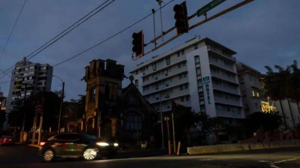 Traffic lights are dark and buildings remained without power in San Juan, Puerto Rico amid a New Year's Eve blackout