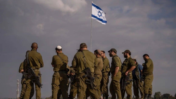 Israeli soldiers on a hill close to the Gaza border in southern Israel, on December 5, 2024