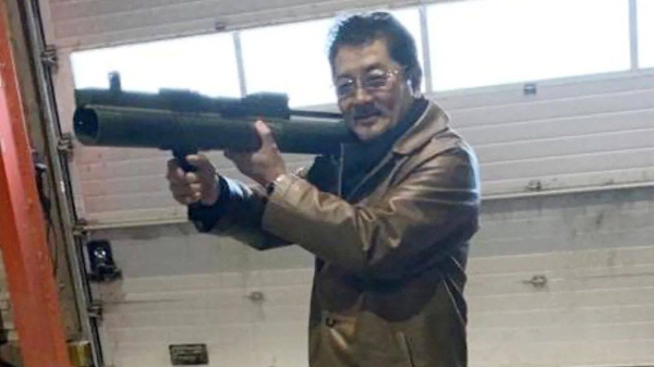 Takeshi Ebisawa poses with a rocket launcher during a meeting with an informant and two undercover Danish police officers at a warehouse in Copenhagen, Denmark on February 3, 2021