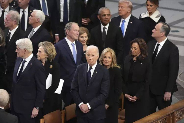 President Joe Biden and first lady Jill Biden watch as the state funeral for former President Jimmy Carter begins at Washington National Cathedral in Washington, Jan 9, 2025