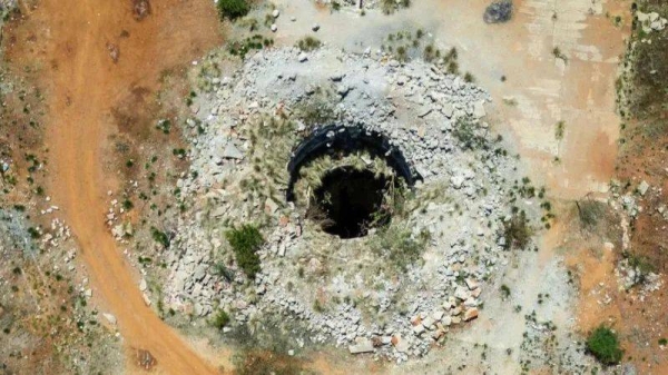 An aerial view shows an open mine shaft in Stilfontein