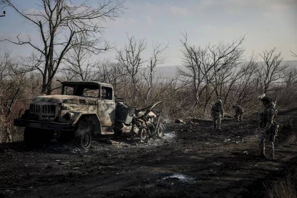 Ukrainian servicemen collect damaged ammunition on the road at the front line near Chasiv Yar, 10 January, 2025