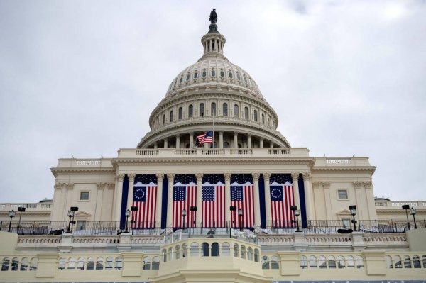 Flags are hung on the Capitol in preparation for Donald Trump’s inauguration in Washington, DC