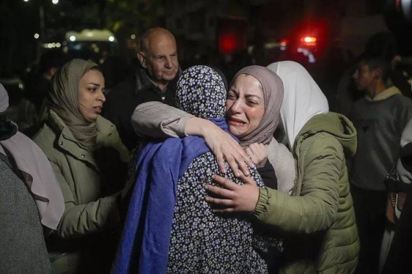 A female Palestinian prisoner is greeted after being released from an Israeli prison in Beitunia, 20 January, 2025