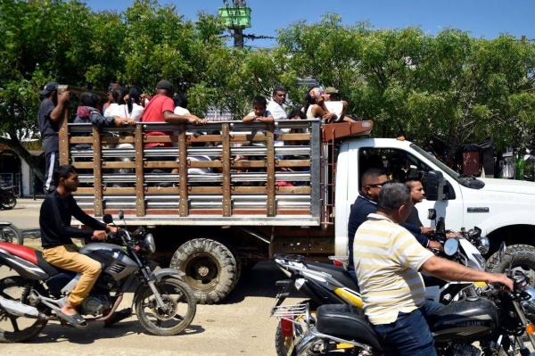 Displaced people from recent clashes between armed groups arrive in the municipality of Tibu, Norte de Santander Department, Colombia, on Saturday