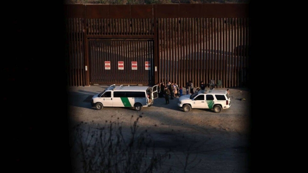 Migrants are processed by Border Patrol San Diego sector agents as seen from Tijuana, Mexico, on January 20, 2025