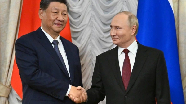 Chinese leader Xi Jinping shake hands with Russian President Vladimir Putin at the 16th BRICS Summit in Kazan, Russia on October 22, 2024