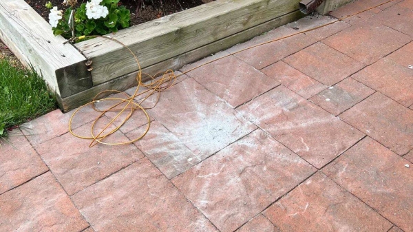 The meteorite that struck the front walkway of Joe Velaidum's home in Canada left a star-shaped pattern of debris on the pavement