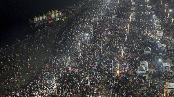 Hindu devotees gather on 29 January, 2025, to take a holy dip at the confluence of the Ganges, the Yamuna and the mythical Saraswati rivers