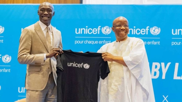 TikTok star Khaby Lame receives a T-shirt from UNICEF Regional Director for West and Central Africa Gilles Fagninou - Dakar, Senegal -