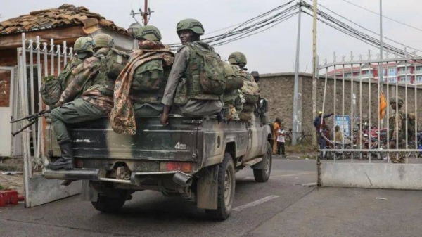 Members of the M23 armed group arrive in a pickup truck at the compound where residents gather for a protest against the Congolese government, expressing support for the M23 armed group in Goma on January 31, 2025