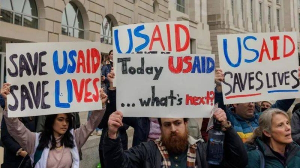 Demonstrators outside the US Agency for International Development (USAID) headquarters in Washington, DC on Monday