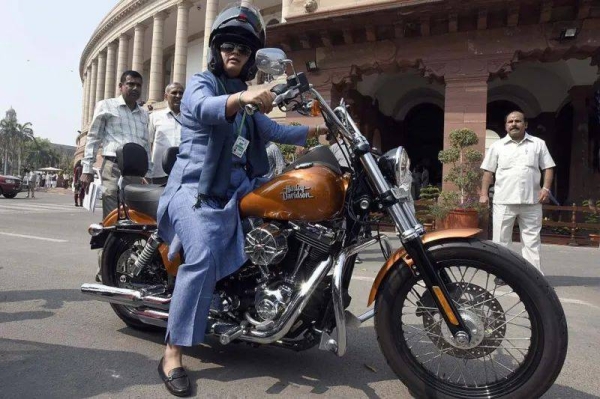 Indian MP Ranjeet Ranjan on her Harley Davidson in 2016 - during his first term Trump brought up the then higher tariffs on the bikes