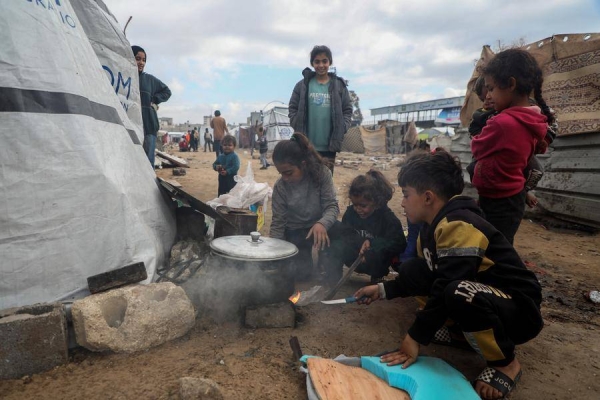 (250205) -- GAZA, Feb. 5, 2025 (Xinhua) -- Palestinian children are seen next to a tent that serves as temporary shelter at the Al-Yarmouk stadium in Gaza City, on Feb. 5, 2025. (Photo by Rizek Abdeljawad/Xinhua)