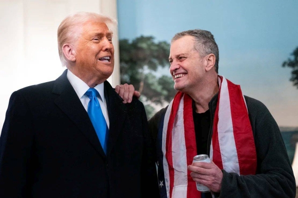 US President Donald Trump (L) welcomes former detainee Marc Fogel to the White House after he was freed from Russia in Washington, DC, on February 11, 2025