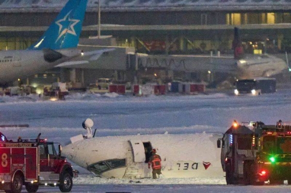 The Delta Airlines plane is seen on runway at Toronto Pearson Airport after crashlanding