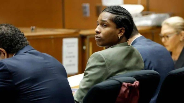 A$AP Rocky seated at a table with attorneys in a LA courtroom as his trial continues