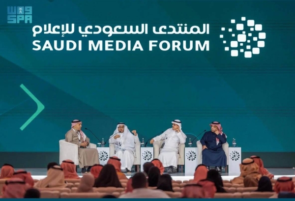 Editor-in-Chief of Okaz newspaper Jameel Al-Theyabi, Political analyst and writer Jasser AlJasser, and Journalist and writer Mishary Al-Dhaidi speaking at a panel discussion during the Saudi Media Forum (SMF).