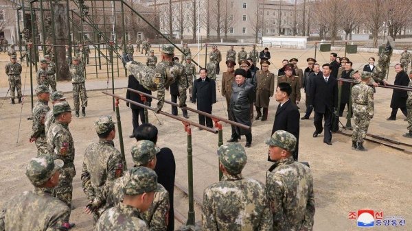North Korean leader Kim Jong Un watches a cadet practicing on the parallel bars during his visit to the Kang Kon Military Academy, in Pyongyang, North Korea, February 25, 2025