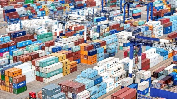 Shipping containers are stacked at a port in Yantai, in eastern China's Shandong province on Thursday