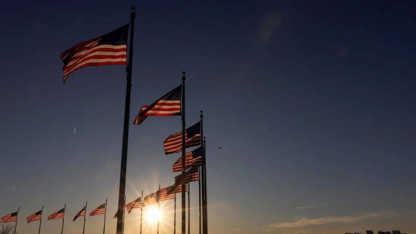 US flags flutter at the Washington Monument in Washington, DC