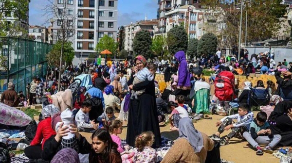 Local residents wait in a park in Istanbul on April 23, 2025, following an initial quake at 12.49 pm