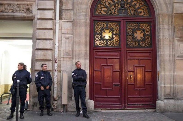 Police outside the luxury apartment where Kim Kardashian was robbed at gun point