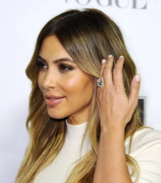 Police outside the luxury apartment where Kim Kardashian was robbed at gun point