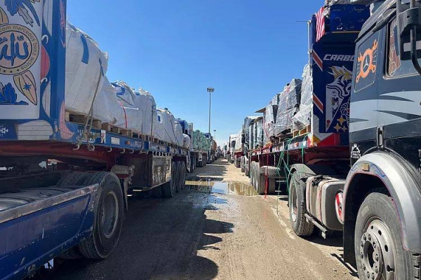 Aid trucks line up at the Egyptian side of the Rafah border crossing between Egypt and Gaza, 2 March, 2025