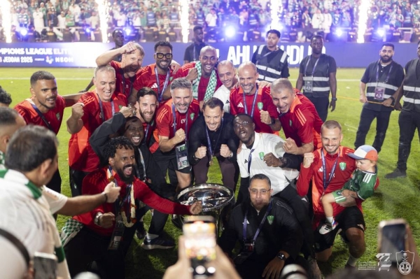 Al Ahli head coach Matthias Jaissle celebrates the trophy. 