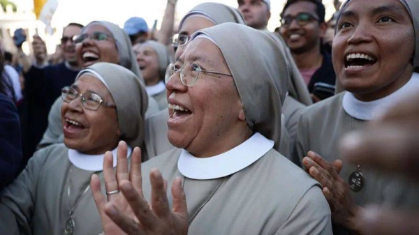 Excited crowds gather in St Peter's Square to see the new Pope