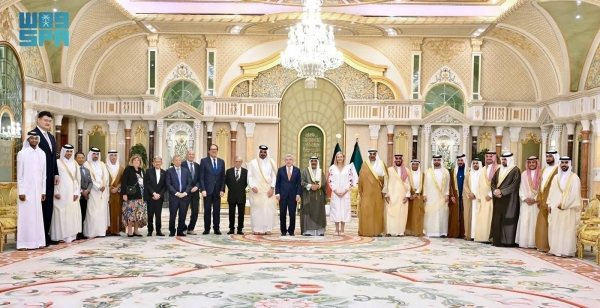 Emir of Kuwait Sheikh Meshal Al-Ahmad Al-Jaber Al-Sabah is flanked by Saudi Minister of Sports Prince Abdulaziz bin Turki Al-Faisal and high ranking officials of International Olympic Committee at the Bayan Palace in Kuwait on Sunday.