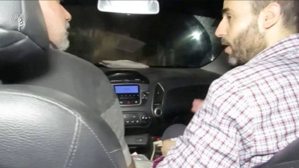 This still from a video released by the Israeli army in December 2023 appears to show Mohammed Sinwar, right, traveling through a tunnel near the Erez crossing, close to the Israel-Gaza border