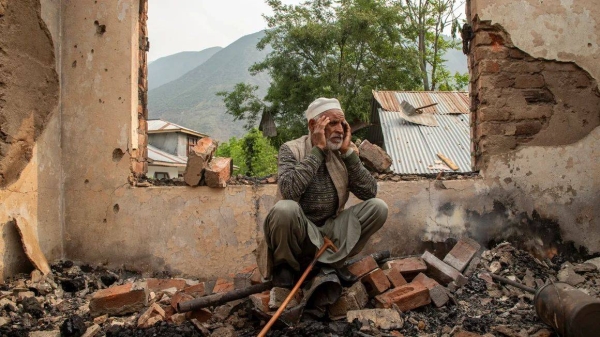 A Kashmir resident looks at his damaged home in Salamabad, near the Line of Control, in India-administered Kashmir on May 8, 2025