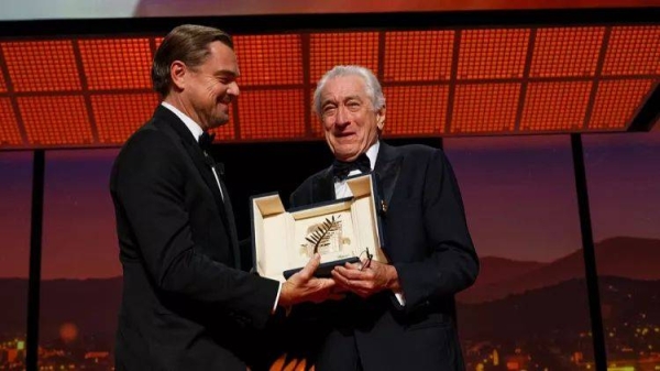 Leonardo DiCaprio, left, and Robert De Niro, recipient of the Honorary Palme d'Or, pose for photographers during the opening ceremony of the 78th international film festival