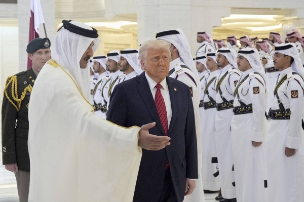 Qatar's Emir Sheikh Tamim bin Hamad Al Thani welcomes President Donald Trump during an official welcoming ceremony at the Amiri Diwan in Doha, Qatar, on Wednesday.