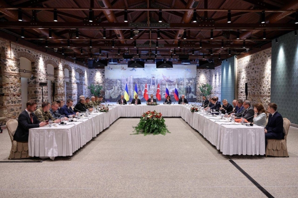 Turkish Foreign Minister Hakan Fidan, center, chairs a Turkey Russia Ukraine trilateral meeting at Dolmabahce Presidential Office in Istanbul, Turkey, on Friday.