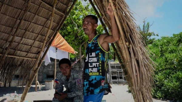 Fisherman Larry Hugo, right, was nearly rammed by a Chinese coastguard ship