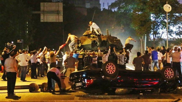 Tanks move into position as people attempt to stop them during the coup attempt in Ankara, 16 July, 2016 -