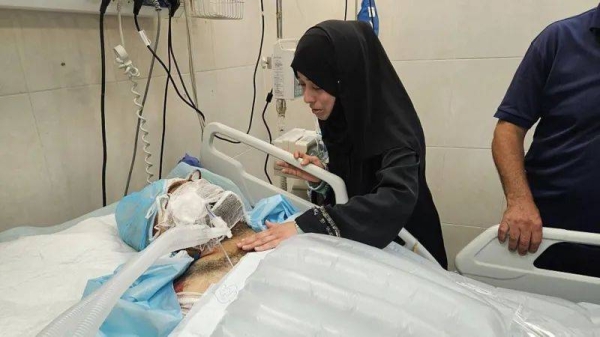 Dr Hamdi al-Najjar, pictured during a visit by his niece, died from his wounds on Saturday, health officials said