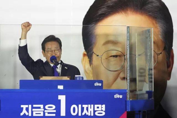 South Korea's Democratic Party's presidential candidate Lee Jae-myung, gestures as he speaks to supporters outside of the National Assembly in Seoul, Wednesday, June 4, 2025